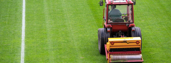 Sowing Grass at a Football Field